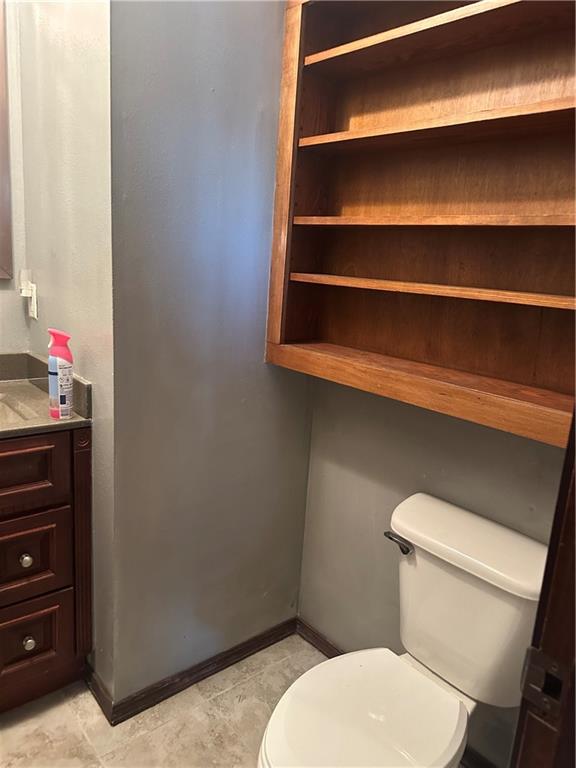 bathroom with toilet and vanity