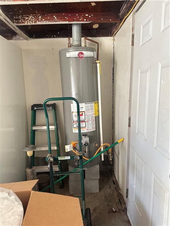 utility room featuring gas water heater