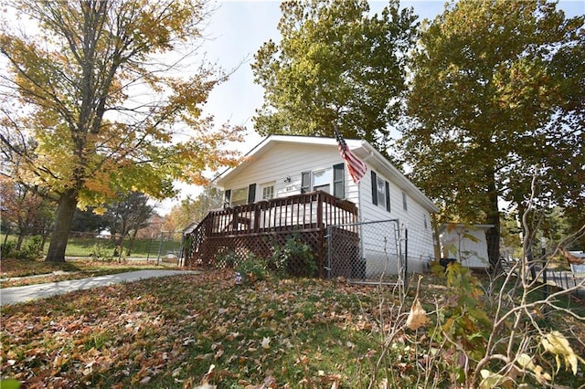 view of front facade with a wooden deck