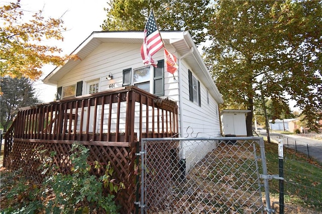 view of side of home with a deck