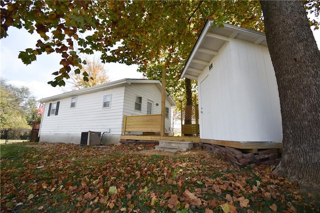 view of side of property featuring central air condition unit