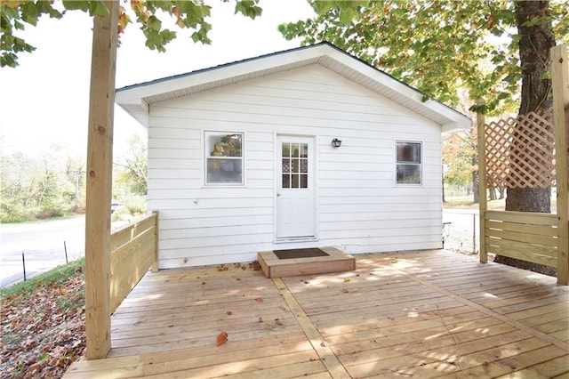 back of property featuring a deck