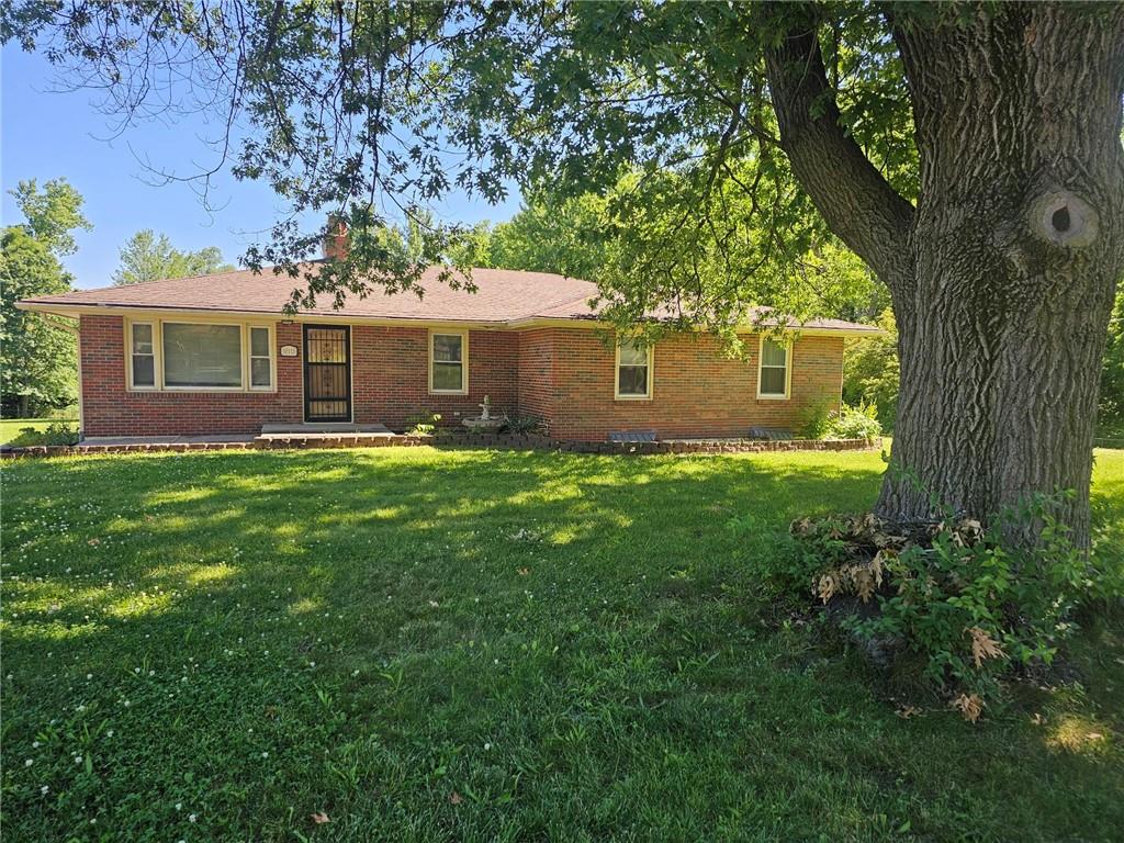 ranch-style house with a front lawn