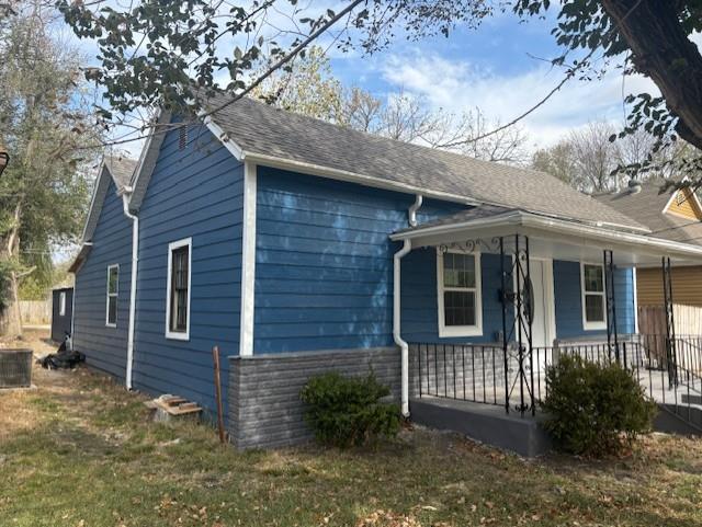 view of property exterior with covered porch