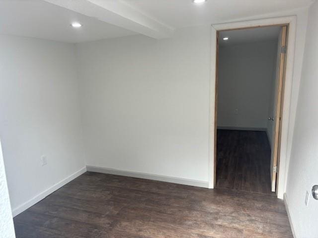 unfurnished room with dark hardwood / wood-style flooring