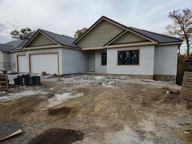 view of front of property featuring a garage