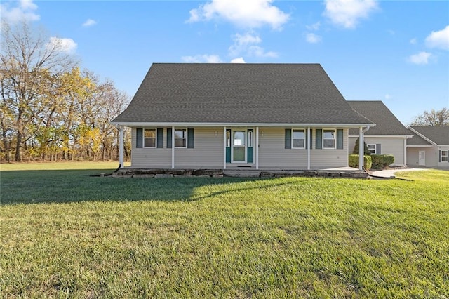 view of front of home featuring a front yard and a garage