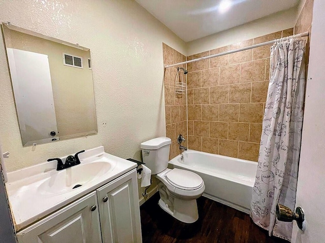 full bathroom featuring vanity, hardwood / wood-style flooring, toilet, and shower / bath combination with curtain