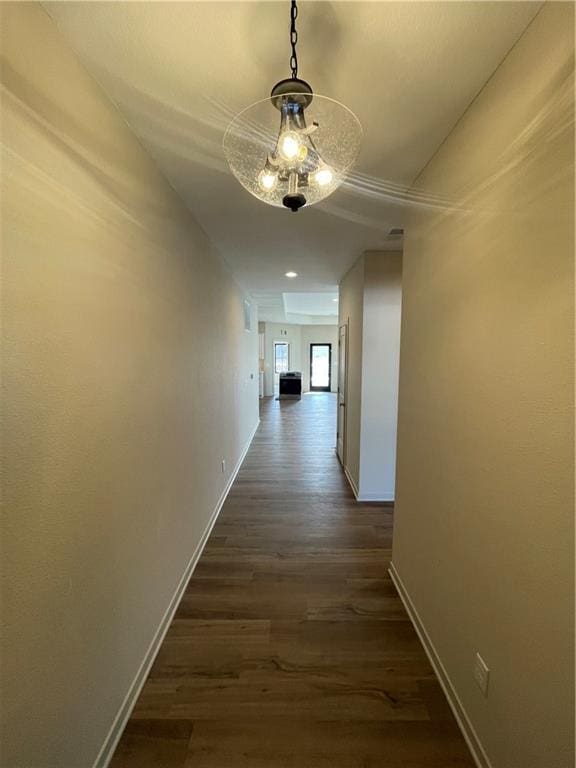 corridor with dark wood-type flooring