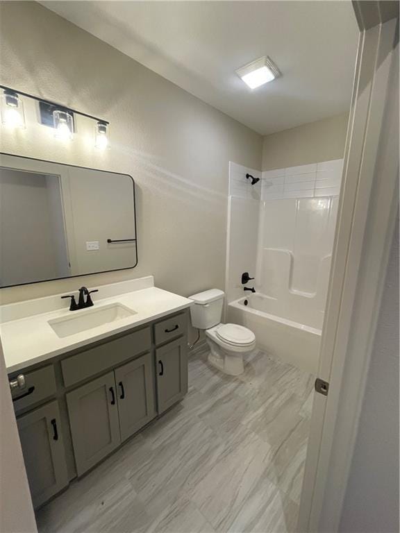 full bathroom featuring shower / washtub combination, vanity, and toilet