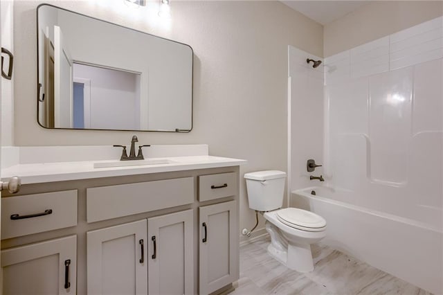 full bath featuring toilet, bathtub / shower combination, and vanity