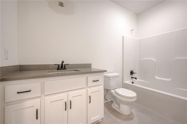 full bath featuring vanity, marble finish floor, shower / bath combination, and toilet