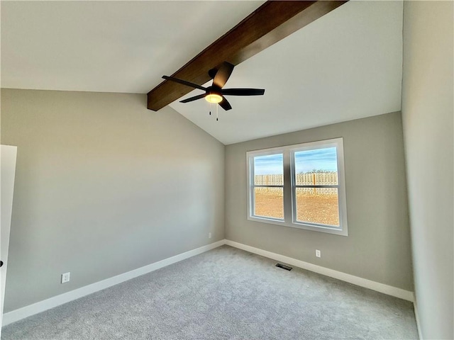 unfurnished room with vaulted ceiling with beams, light colored carpet, and ceiling fan