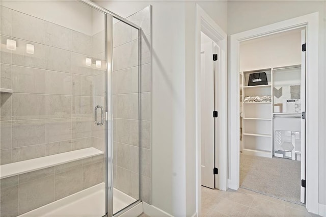 bathroom featuring tile patterned flooring and walk in shower