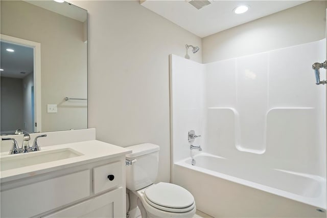 full bathroom with vanity, shower / bathtub combination, and toilet