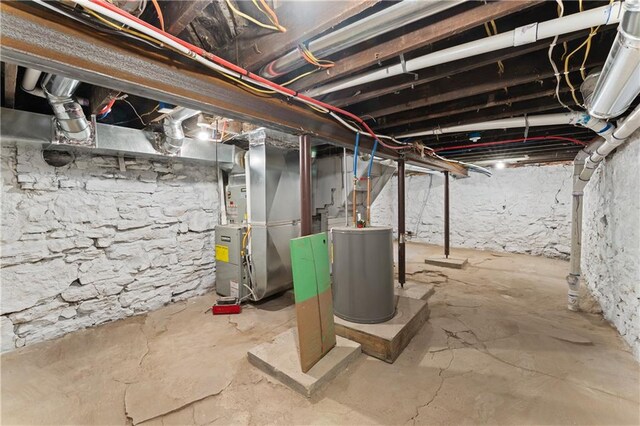 basement with water heater and heating unit