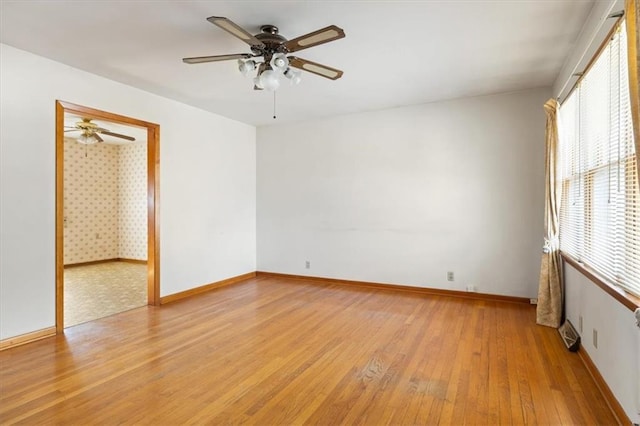 unfurnished room featuring light hardwood / wood-style floors and ceiling fan