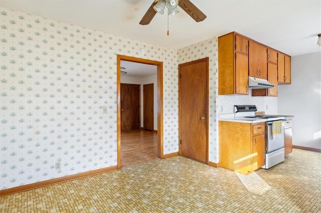 kitchen featuring ceiling fan, light wood-type flooring, and electric stove