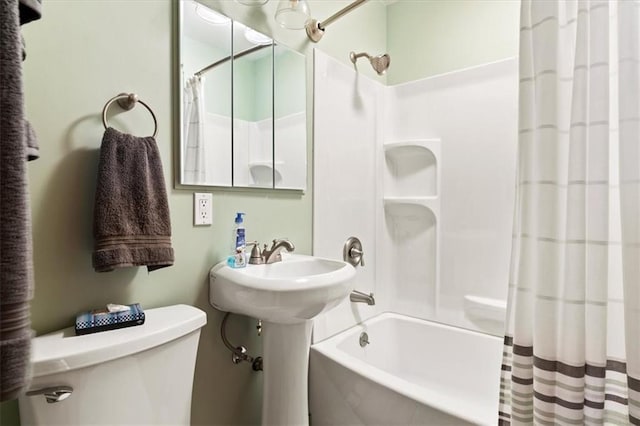 bathroom with toilet and shower / bathtub combination with curtain