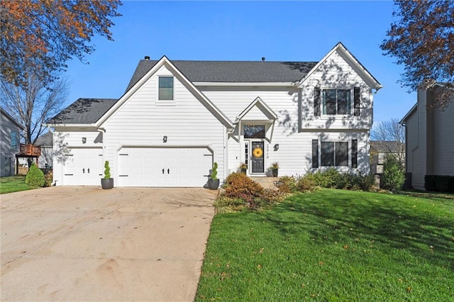 view of front of home with a garage and a front lawn