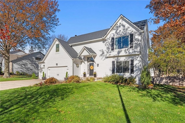 view of front facade featuring a garage and a front lawn