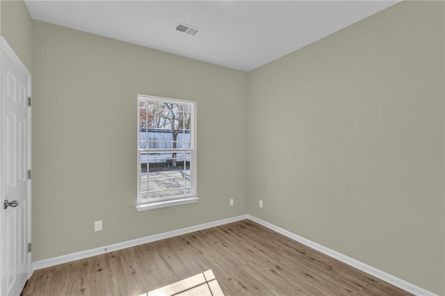 empty room with light hardwood / wood-style floors