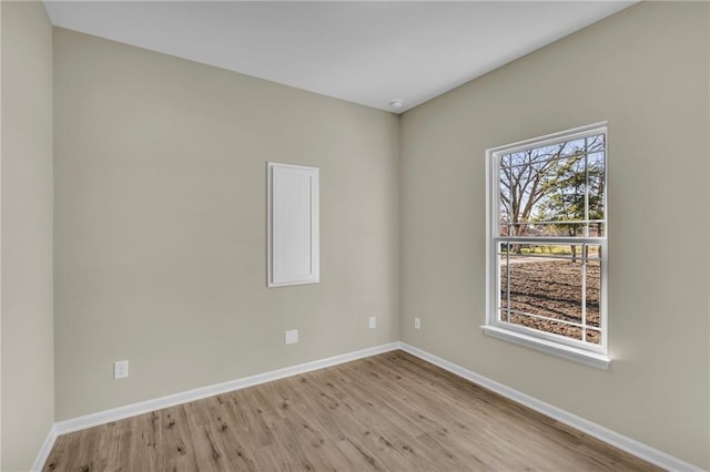 unfurnished room with light wood-type flooring