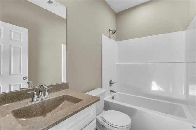 full bathroom featuring vanity,  shower combination, and toilet