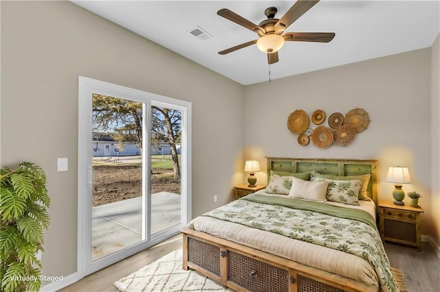 bedroom featuring ceiling fan, access to outside, and light hardwood / wood-style flooring