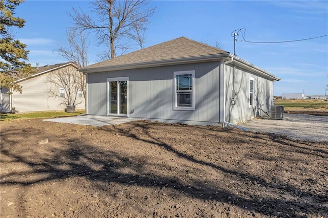 rear view of property featuring central air condition unit and a patio area