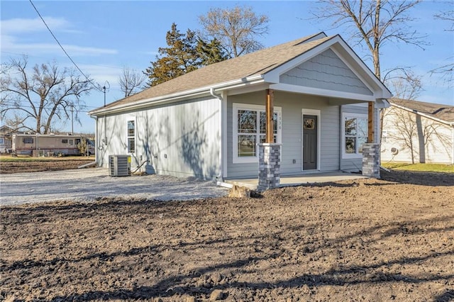 view of front facade with central AC unit and a porch