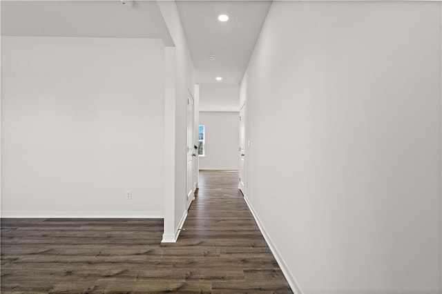 corridor featuring dark wood-type flooring