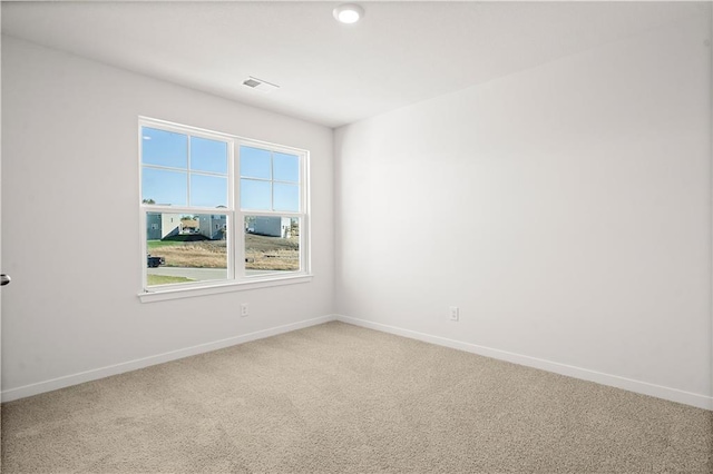 unfurnished room with carpet floors