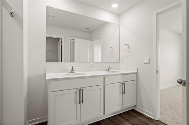 bathroom featuring vanity and hardwood / wood-style floors