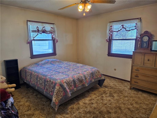 bedroom featuring ceiling fan and carpet floors