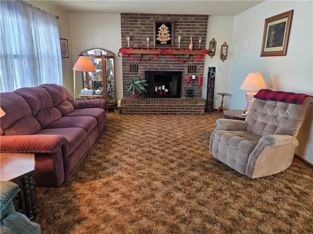 living room with a fireplace and dark colored carpet