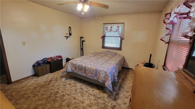 bedroom featuring ceiling fan and carpet floors