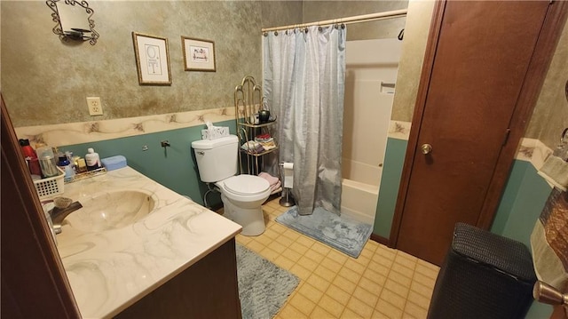 full bathroom featuring toilet, vanity, and shower / tub combo with curtain