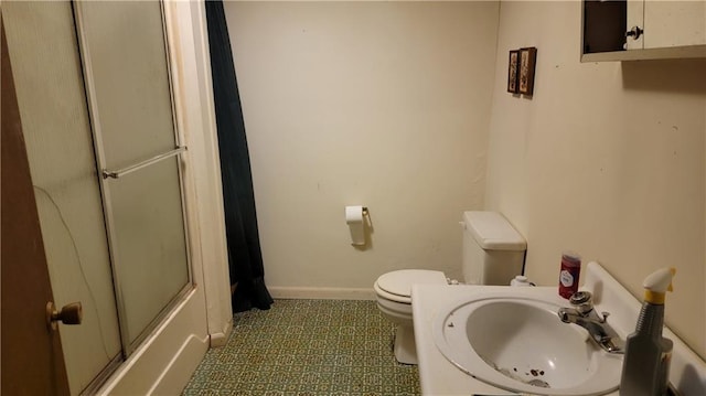 bathroom with sink and toilet