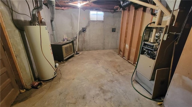 basement featuring heating unit and water heater