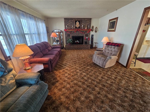 living room featuring a fireplace, dark carpet, and a textured ceiling