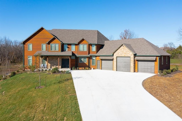 20473 199th St, Tonganoxie, KS 66086 - view of front of property with an attached garage, a front yard, driveway, and stone siding