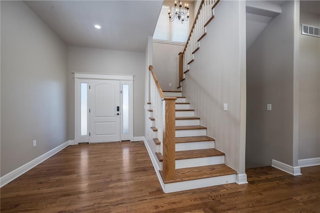 20473 199th St, Tonganoxie, KS 66086 - foyer with wood finished floors, stairway, a chandelier, baseboards, and recessed lighting