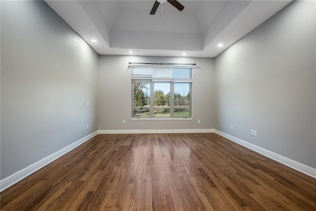 20473 199th St, Tonganoxie, KS 66086 - empty room with ceiling fan, dark wood-style flooring, baseboards, a tray ceiling, and recessed lighting