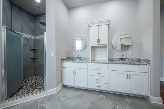 20473 199th St, Tonganoxie, KS 66086 - full bath featuring double vanity, tiled shower, and baseboards