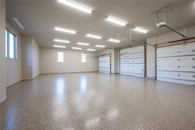 20473 199th St, Tonganoxie, KS 66086 - garage featuring a garage door opener and baseboards