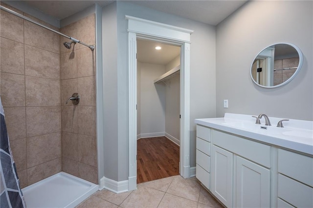 20473 199th St, Tonganoxie, KS 66086 - bathroom with a tile shower, vanity, and tile patterned flooring