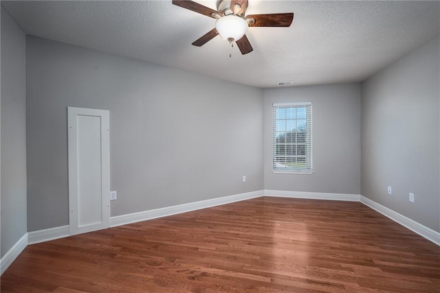 20473 199th St, Tonganoxie, KS 66086 - empty room featuring wood finished floors, ceiling fan, baseboards, and a textured ceiling