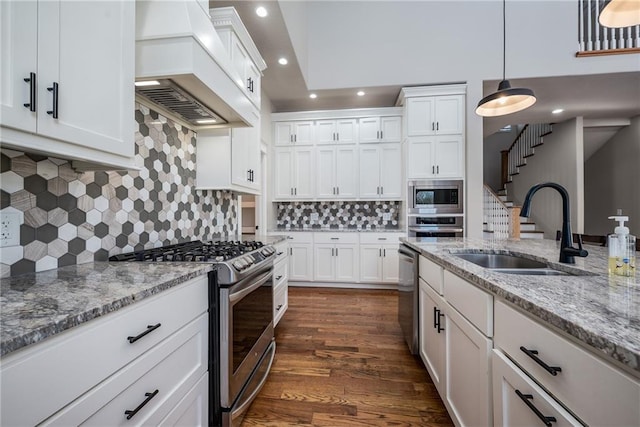 20473 199th St, Tonganoxie, KS 66086 - kitchen with stainless steel appliances, a sink, premium range hood, white cabinets, and recessed lighting