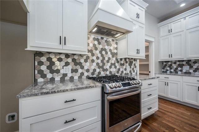 20473 199th St, Tonganoxie, KS 66086 - kitchen with stainless steel gas range, custom range hood, backsplash, white cabinetry, and light stone countertops
